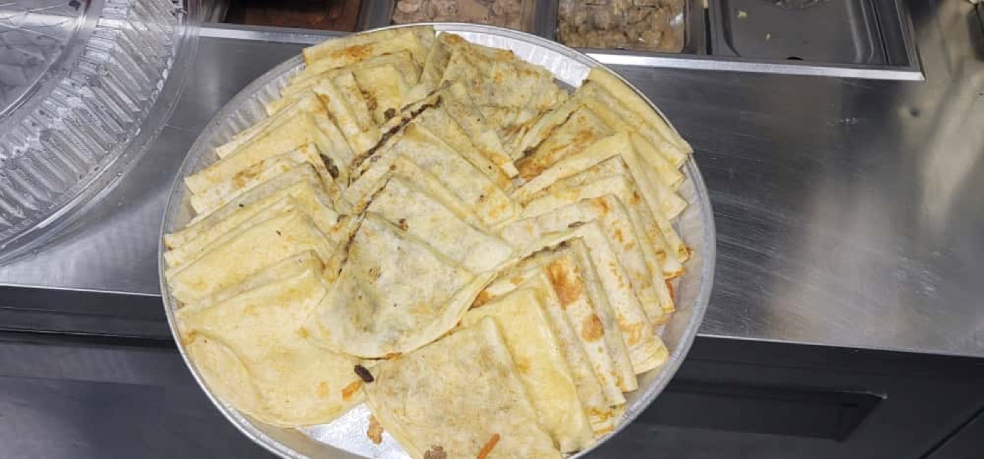 Catering tray of quesadillas cut into triangles
