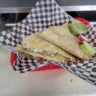 Super Quesadilla with sour cream and guacamole